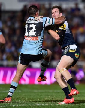 Tough loss: Wade Graham tries to tackle Michael Morgan during the NRL semi-final between the North Queensland Cowboys and the Cronulla Sharks in Townsville last September.