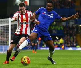Chelsea's John Mikel Obi and Adam Johnson of Sunderland compete for the ball.