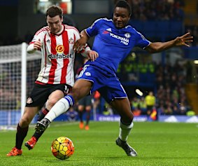 Chelsea's John Mikel Obi and Adam Johnson of Sunderland compete for the ball.