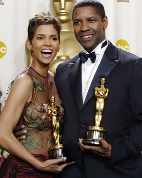 Halle Berry and Denzel Washington with the Oscars they both won at the Academy Awards in 2002. 
