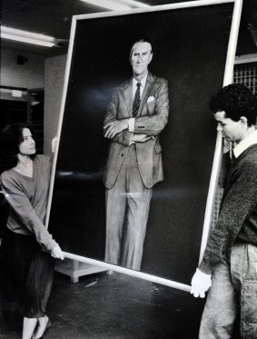 The disliked portrait being moved by National Gallery staffers Sara Kelly and Tim Fisher in 1985.