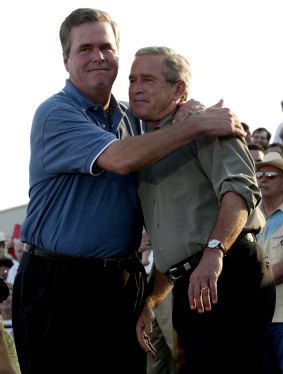 Waiting his turn: Jeb Bush, left, embraces brother George in 2004.