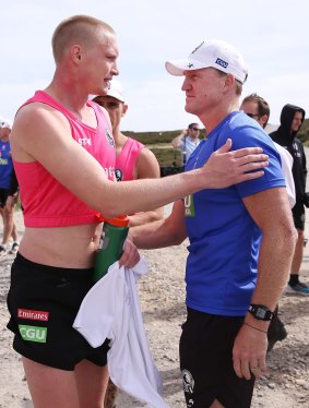 Collingwood coach Nathan Buckley with Jack Frost after the Magpies’ fitness camp triathlon at Falls Creek on Friday.