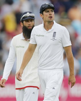 Worried: England's Alastair Cook and Moeen Ali walk off at the end of play.