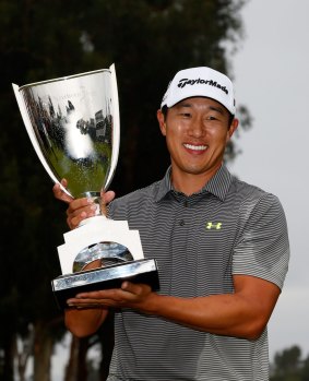 James Hahn holds his trophy.