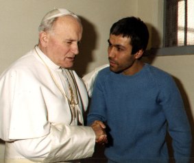 Pope John Paul meets Mehmet Ali Agca who  tried to assassinate him.