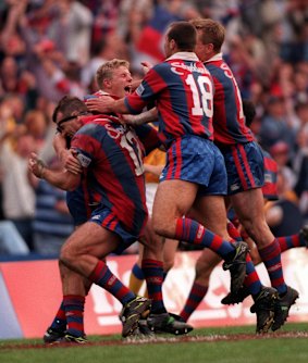 Prince Albert: Darren Albert and the Knights celebrate an improbable grand final victory in 1997.