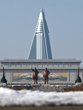 Statues of late leaders Kim Il Sung, left, and Kim Jong Il, right, at Mansu Hill near the Ryugyong Hotel.