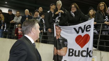 Buck up: Fans show Collingwood President Eddie McGuire their support for coach Nathan Buckley.