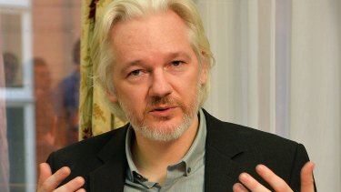 Julian Assange gestures during a press conference inside the Ecuadorian embassy in London in August 2014.
