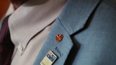 Malcolm Roberts wears a senator's pin to a his press conference on Friday.