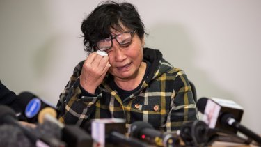 The mother of terror victim Nick Hao fights back tears as she remembers her son.