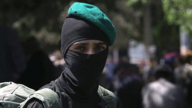 A masked militant from the Izzedine al-Qassam Brigades, a military wing of Hamas, in Gaza.