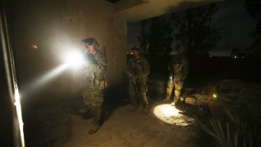 Aussie diggers clear buildings prior to the Iraqi soldiers starting their night time activities.