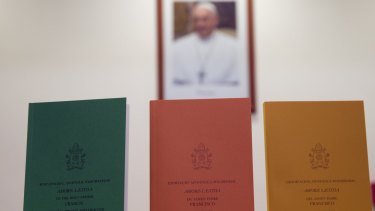 Copies of the post-synodal apostolic exhortation ' Amoris Laetitia ' (The Joy of Love) on display prior to the start of a press conference, at the Vatican on Friday.