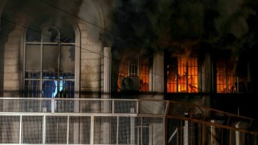 Smoke billows from the windows of the burning Saudi Arabian embassy in Tehran following a protest by Iranian activists.