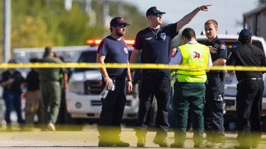 Law enforcement officials at the scene of a fatal shooting at the First Baptist Church in Sutherland Springs, Texas, on Sunday.