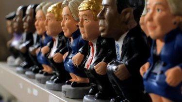 For sale: Presidential candidates Hillary Clinton, Donald Trump and US President Barack Obama are displayed at a shop in Barcelona, Spain.
