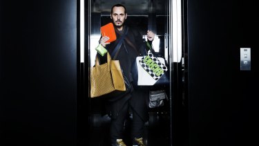 Boys keep swinging: Fashion stylist Fernando Barraza with a selection of man bags.