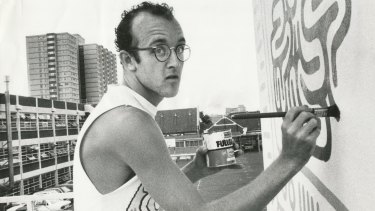 New York graffiti artist Keith Haring at work on the Collingwood Technical School wall in Johnston Street in March 1984.