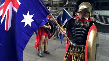 Protesters dressed in costume and carrying Australian flags attend a "Reclaim Australia" protest in Martin Place.