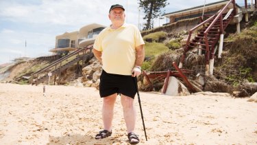 Pat Aiken, a regional co-ordinator of the NSW Coastal Alliance, near damaged properties at Wamberal.