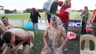 Ice bucket challenges, like this one at North Dalton Park, raised $3 million in Australia.