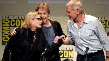 Carrie Fisher, Mark Hamill and Harrison Ford speak on stage at the Lucasfilm panel during Comic-Con International 2015.