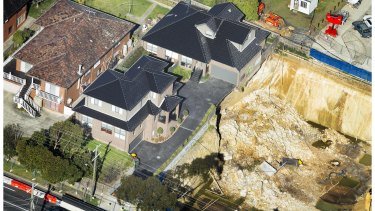 Two townhouses sit on the edge off an excavation in Mount Waverley. 
