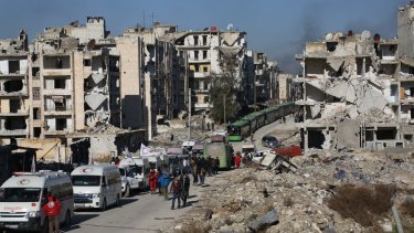 A convoy including buses and ambulances waits at a crossing point to evacuate civilians trying to flee Aleppo last week.