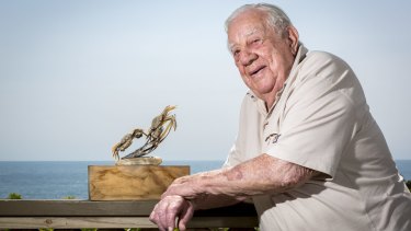 Noel Crocker with an early Nambucca Nippers trophy. The 94-year-old helped start the Nippers in 1961.