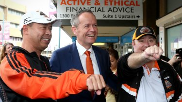 Mr Shorten meets with people during a street walk in Campbelltown, NSW. 
