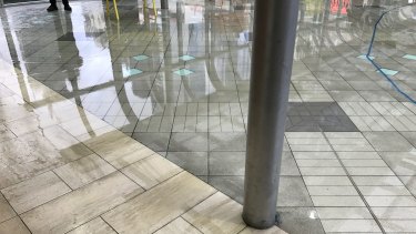 Water across the walkway that runs between Emporium and Melbourne Central in the CBD yesterday afternoon.