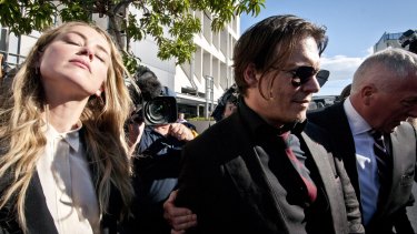 Relieved actor Johnny Depp and his actress wife Amber Heard leave Southport Court after a magistrate imposed a one month good behaviour bond on Ms Heard without conviction.