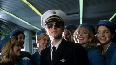 Leonardo DiCaprio surrounded by airline stewardess in <i>Catch Me If You Can</i>.