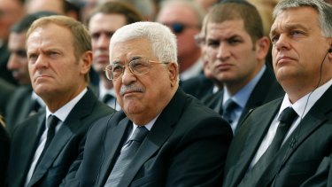 Palestinian President Mahmoud Abbas, centre, sits alongside European Council president Donald Tusk.
