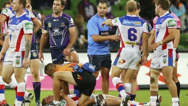 Turbulent times: The fateful tackle that left Alex McKinnon in a wheelchair.