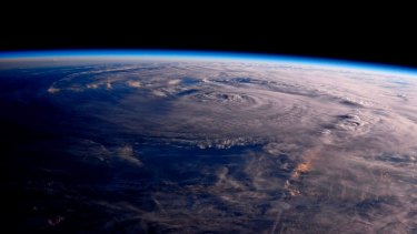A photo taken from the International Space Station shows Hurricane Harvey over Texas on Saturday.