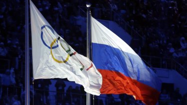 The Russian and Olympic flags fly at the Sochi winter Olympics, where medallists were involved in doping.