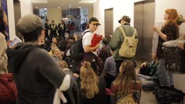 Protesters inside the Immigration Department building in Melbourne on Thursday evening.