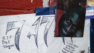 A photo of Eric Garner is displayed at a makeshift memorial, where he died during an arrest in July, in the Staten Island borough of New York.