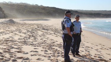 Fatal accident: Police at the scene on Terrace Beach, in Ben Boyd National Park, after a sand dune collapsed on a boy.