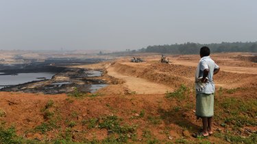 A Gonds tribesman looks over central India’s Parsa East and Kante Basan coal mine. Operated by Adani, the mine has had a severe impact on the local environment.