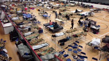 Beds are set up on the gym floor at and evacuation centre in Anzac, Alberta.