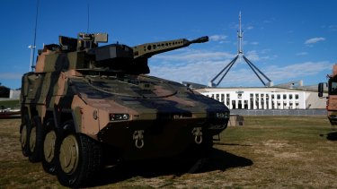 A combat reconnaissance vehicle outside Parliament last month. This model was built by Rheinmetall, which is a contender to build the new vehicles.