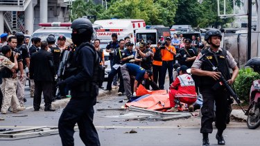 Police at the site of a series of explosions in central Jakarta. 