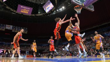 Under pressure: Jerome Randle tries to pass the ball during yesterday's NBL match between Melbourne United and the Sydney Kings.