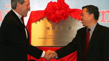 Then Chinese vice-minister of health, Huang Jiefu, right, during the opening of a Sino-US collaborative office at the Chinese Centre for Disease Control in 2006.