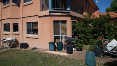 Trolleys and rubbish in the backyard of a house in Ebony Close, Hillvue, one of many properties rented by Frank Lin.