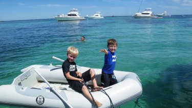 Mrs Bowe's sons John and James in the turquoise waters off Rottnest.